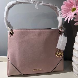 Michael Kors pInk suede and leather shoulder bag.